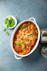 Traditional homemade lasagna with fresh basil	