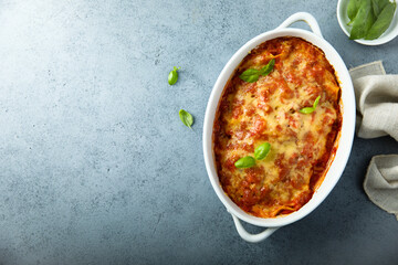 Traditional homemade lasagna with fresh basil	