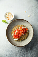 Healthy quinoa porridge with fresh strawberry