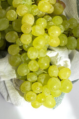 Bunch of green grapes on white background