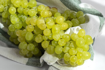 Bunch of green grapes on white background