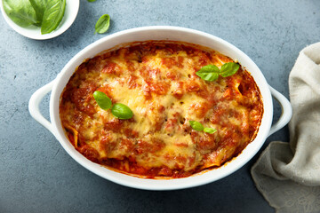 Traditional homemade lasagna with fresh basil	
