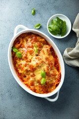 Traditional homemade lasagna with fresh basil	