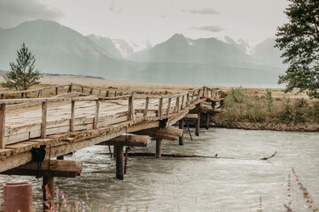 wooden bridge over river 