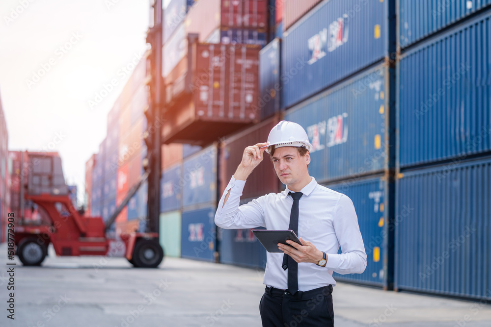 Poster Manager working and discuss in shipping container in Container Terminal,logistic and business export.