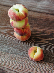 Peaches on a wooden surface
