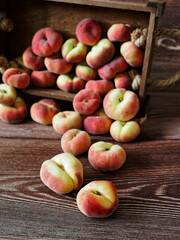 Peaches fallen from a wooden basket