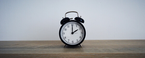 Analog alarm clock pointing at hours, minutes, seconds to display time - Photo of digital timer for...