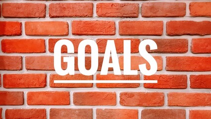 red brick wall with text - goals