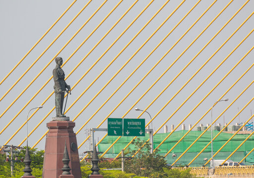 King Rama VIII Statue Near The Bridge Of Bangkok, Thailand