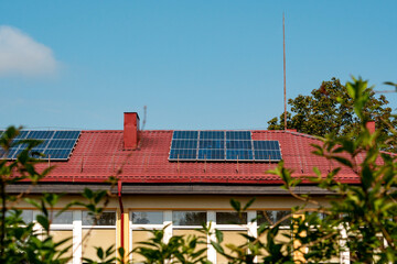 Photovoltaic or solar panels on a red roof