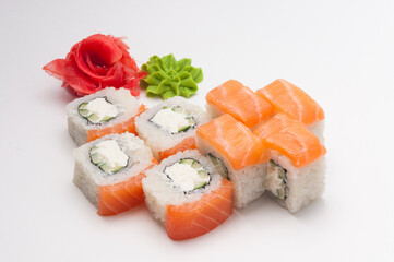 philadelphia sushi rolls: salmon, cream cheese, cucumber on a white background