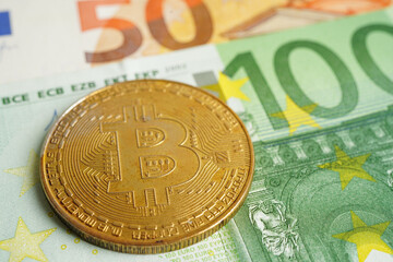 Golden bitcoin on Euro banknotes money for business and commercial, Digital currency, Virtual cryptocurrency.