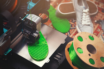 custom FDM-printer makes a shoe sole with distinct inner structure from bright green plastic...