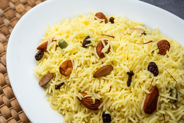 Kashmiri sweet modur pulao made of rice cooked with sugar, water flavored with Saffron and dry fruits