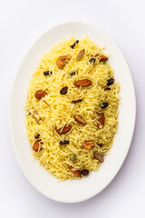 Kashmiri sweet modur pulao made of rice cooked with sugar, water flavored with Saffron and dry fruits