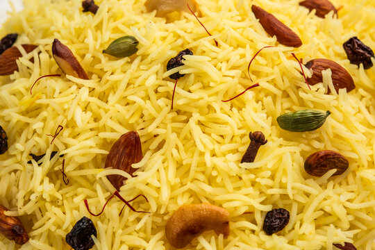 Kashmiri sweet modur pulao made of rice cooked with sugar, water flavored with Saffron and dry fruits