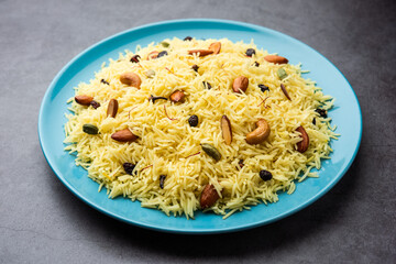 Kashmiri sweet modur pulao made of rice cooked with sugar, water flavored with Saffron and dry fruits