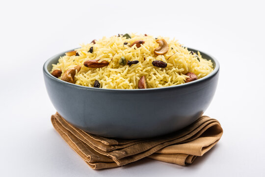 Kashmiri sweet modur pulao made of rice cooked with sugar, water flavored with Saffron and dry fruits