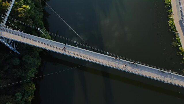 Aerial shot the city Zhytomyr. Pedestrian suspended bridge through the r. Teteriv. Ukraine