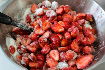 Ripe strawberries with sugar in a bowl