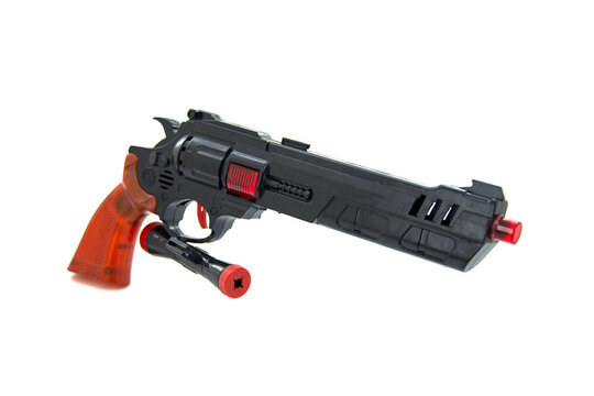Toy gun black pistol for fun isolated on the white background