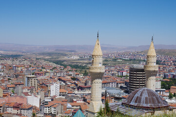 In the foreground a mosque and in the background the city of Nevsehir - Turkey