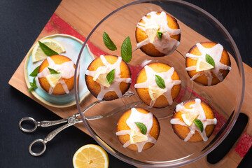 Food Concept Homemade organic mini Lemon cake on wooden board with black copy space