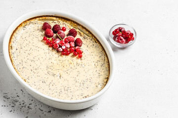Delicious cottage cheese casserole, poppy seeds, frozen berries. Top view, copy space.