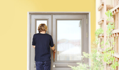 Man opening the door of her home.Inviting the guests