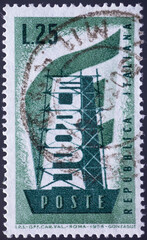 ITALY - CIRCA 1956: a postage stamp from ITALY , showing the word Europe vertically in a steel framework in front of a European flag. Circa 1956