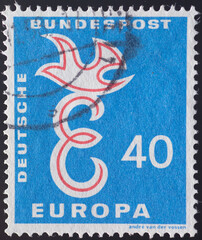 Germany - circa 1958: a postage stamp from Germany , showing a capital E and a dove on it as a...
