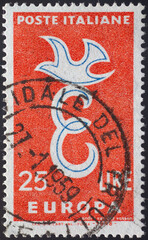 Italy - circa 1958: a postage stamp from Italy , showing a capital E and a dove on it as a...