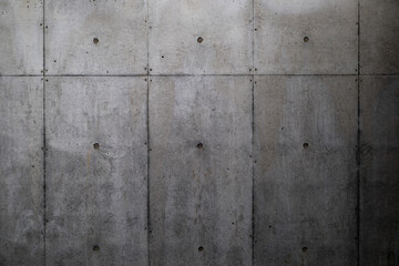 【背景素材】溝のあるPコン穴あり・暗めの打ちっぱなしのコンクリートの壁（千葉県）