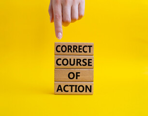 Correct course of action symbol. Concept words Correct course of action on wooden blocks. Beautiful yellow background. Businessman hand. Business and Correct course of action concept. Copy space.