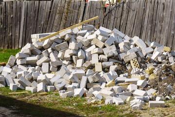 Pile of stones on the ground construction, a destructive pile, a destroyed road, and then dumped on the ground