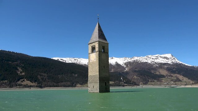 The famous bell tower of the sunken church in the Reschensee, Italy