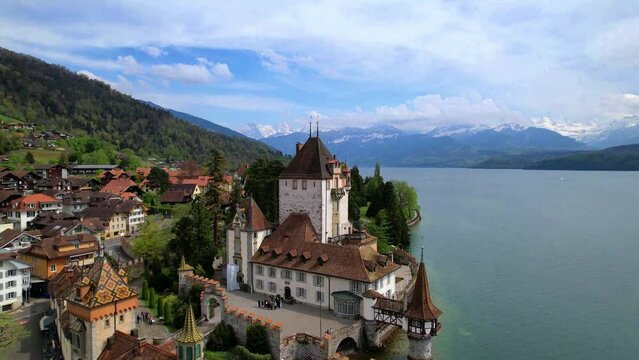 aerial drone video of Oberhofen - Most Beautiful Castle to Visit on Lake Thun, Switzerland