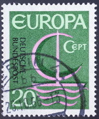 GERMANY - CIRCA 1966: a postage stamp from GERMANY, showing a boat with sails and waves and graphics with the letters CEPT formed. Text : EUROPE. Circa 1966