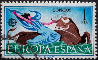 Spain - circa 1966: a postage stamp from Spain, showing a man taking a bull by the horns. CEPT...