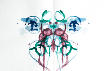 Abstract ink blot test used in psychoanalysis. Colorful symmetric shapes on white background for...