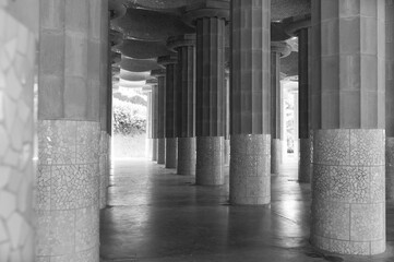 black and white photo of columns in the city