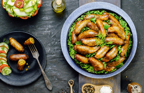 Arabic cuisine; Traditional Egyptian food "Mombar".It's beef sausage stuffed with rice mixture ,minced meat and deep fried in oil.