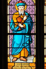 Ploumilliau (Plouilio), France. Stained glass window depicting Saint Joseph of Arimathea with the holy grail inside St Miliau Church - obrazy, fototapety, plakaty