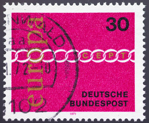 GERMANY - CIRCA 1971: a postage stamp from GERMANY, showing a chain with chain links as a symbol of...