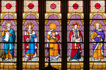 Ploumilliau (Plouilio), France. Stained glass window in St Miliau Church depicting saints John,...