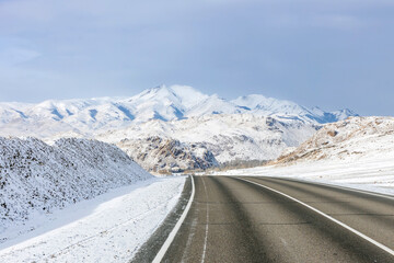 Fototapeta premium empty highway in a mountain valley in winter