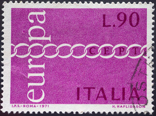 ITALY - CIRCA 1971: a postage stamp from ITALY, showing a chain with chain links as a symbol of...