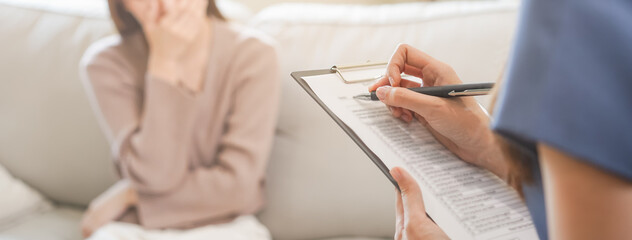 Psychology, depression. Sad, suffering asian young woman consulting with psychologist, psychiatrist...