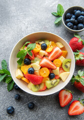 Fototapeta na wymiar Healthy fresh fruit salad in a bowl
